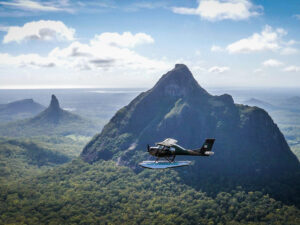 Seaplane flies to the Glass House Mountains