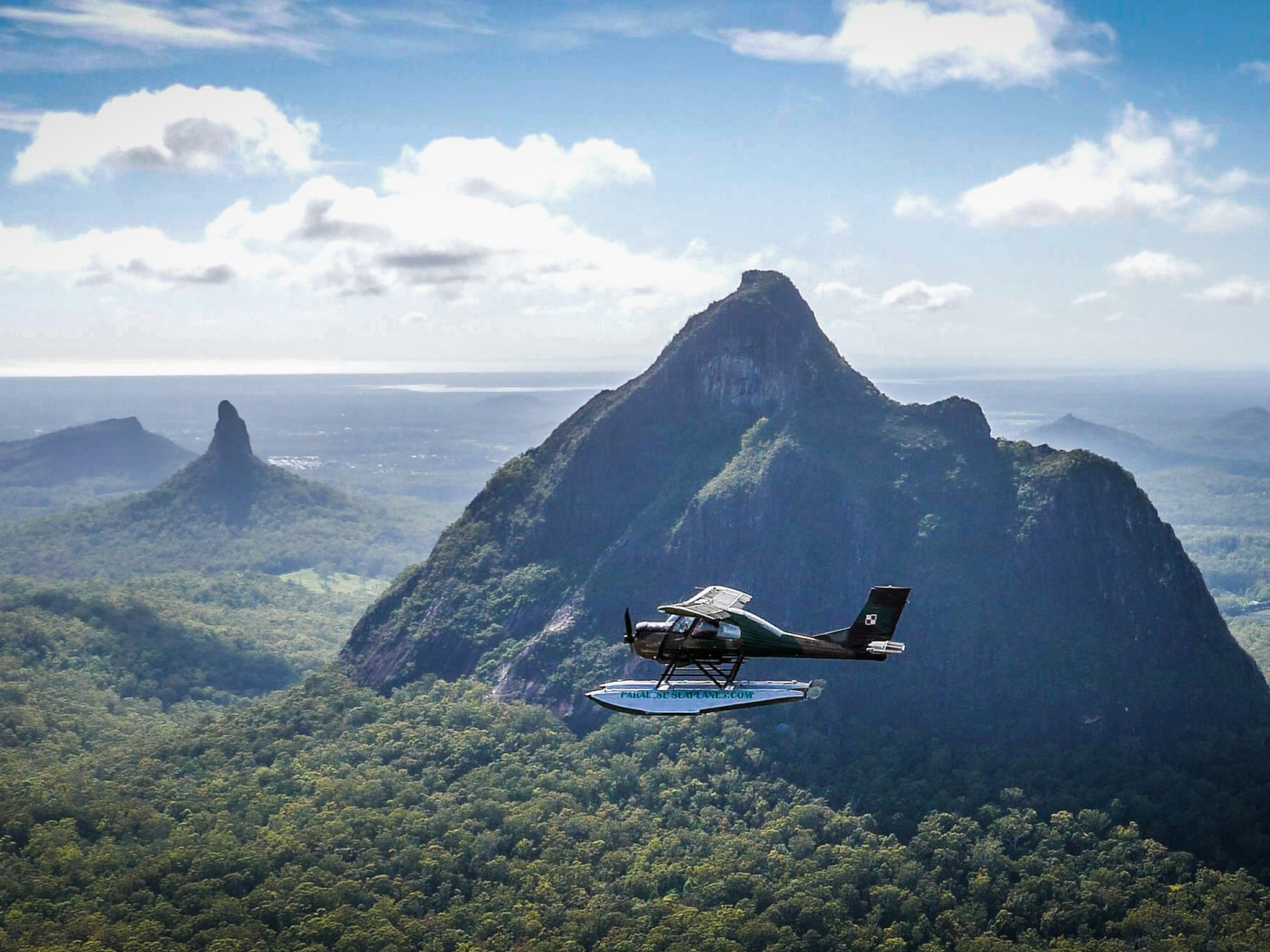 Seaplane flies to the Glass House Mountains