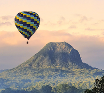 Hot air balloon over glasshouse mountains