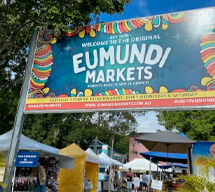 eumundi market sign and stall holder tents