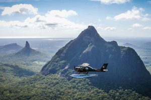 Seaplane flies to the Glass House Mountains